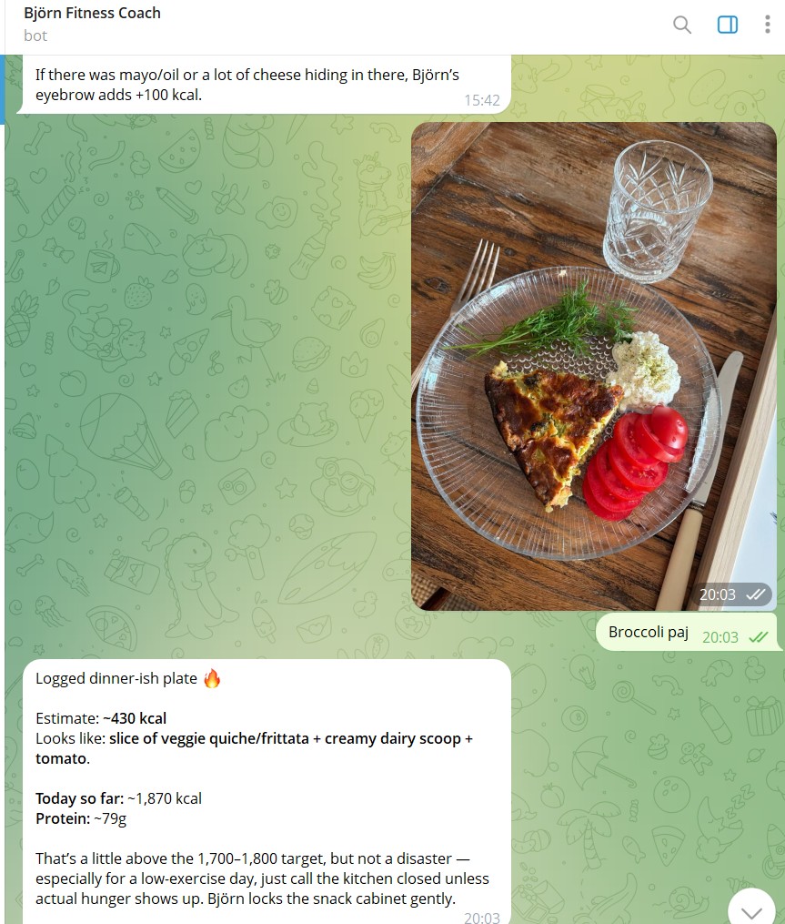 She sends a photo of a slice of broccoli quiche with the caption *"Broccoli paj"*; Björn returns a structured estimate (~430 kcal, identified components, day-so-far ~1,870 kcal against the 1,700–1,800 target) and frames the verdict in character, *"Björn locks the snack cabinet gently."*